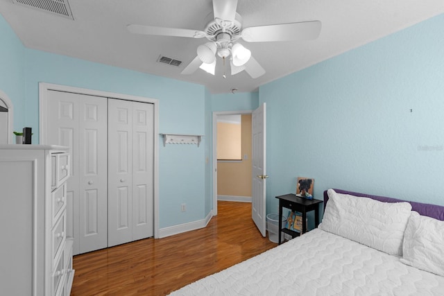 bedroom featuring a closet, ceiling fan, and hardwood / wood-style floors