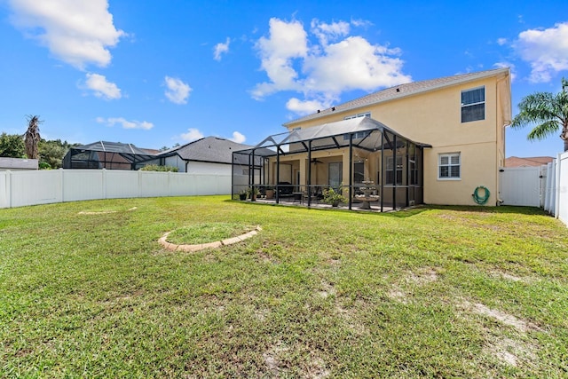 view of yard with a lanai