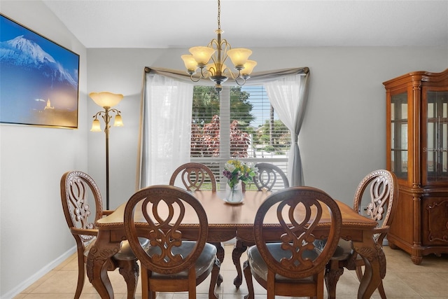 dining area with an inviting chandelier and light tile patterned floors