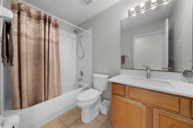 full bathroom with vanity, a textured ceiling, shower / tub combo with curtain, toilet, and tile patterned floors