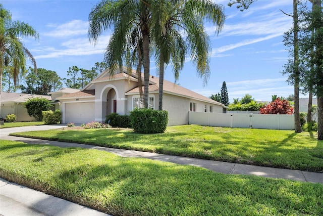 view of front of house featuring a front yard and a garage