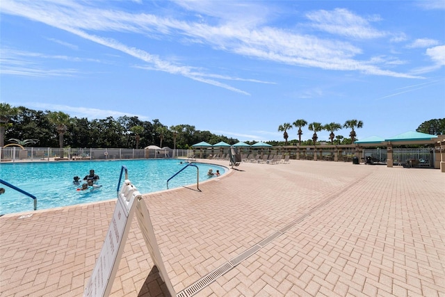 view of swimming pool with a patio area