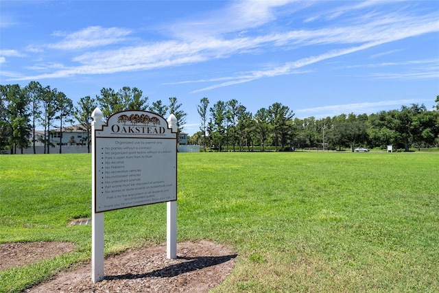 view of home's community with a yard