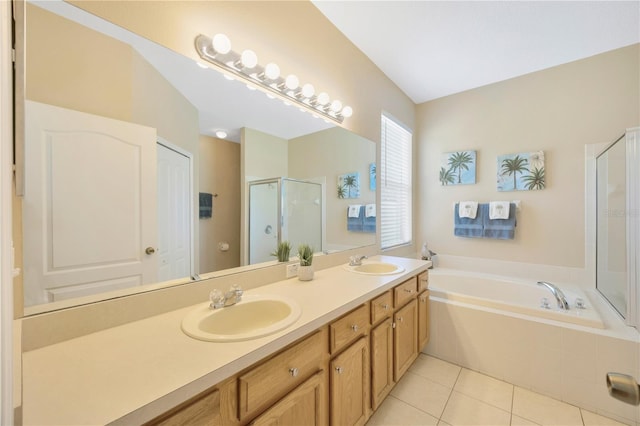 bathroom with tile patterned flooring, vanity, and shower with separate bathtub