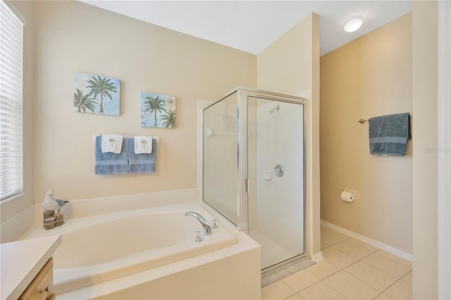 bathroom with separate shower and tub, vanity, plenty of natural light, and tile patterned floors