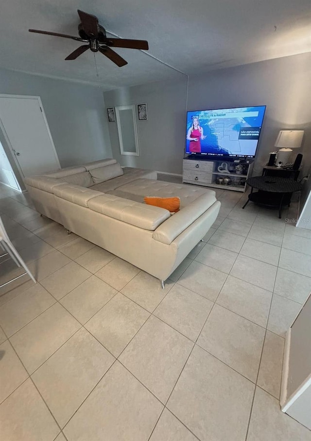 living room with light tile patterned flooring and ceiling fan