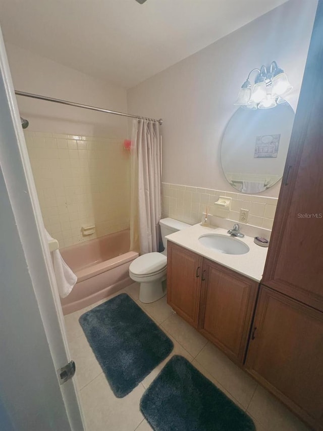 full bathroom featuring vanity, shower / bath combo, toilet, and tile patterned flooring