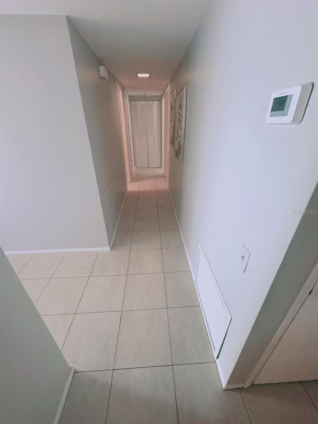 corridor with light tile patterned floors