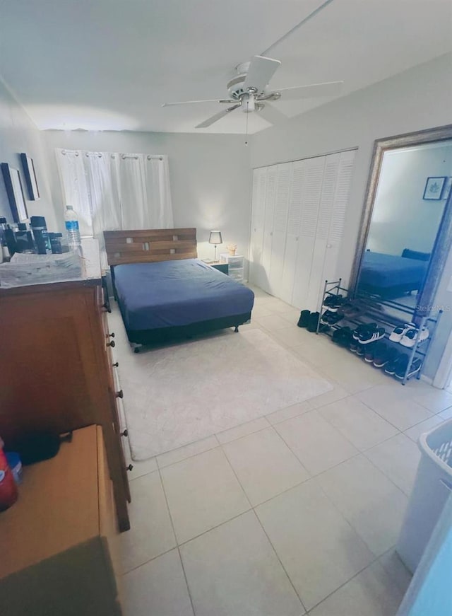 bedroom featuring ceiling fan and light tile patterned flooring