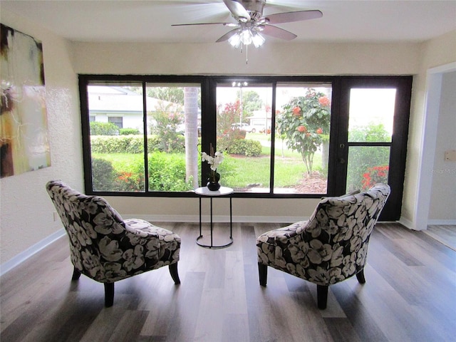 living area with light hardwood / wood-style floors and plenty of natural light