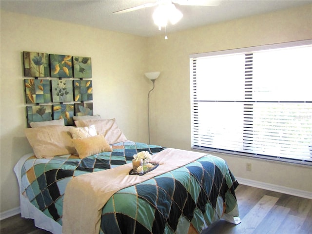 bedroom featuring ceiling fan and wood-type flooring