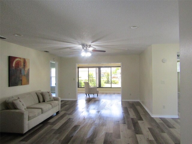 2501 Lonigan Pl, Sun City Center, FL 33573 - living room featuring wood finished floors, a wealth of natural light, a ceiling fan, and baseboards