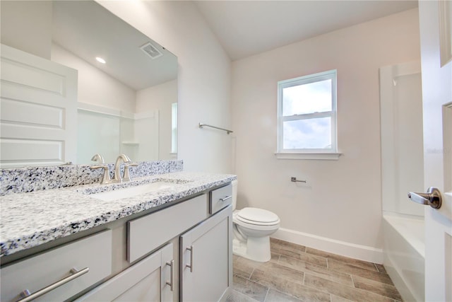 bathroom featuring vanity and toilet