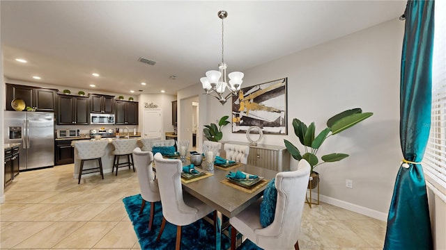 dining room with an inviting chandelier, light tile patterned flooring, and sink