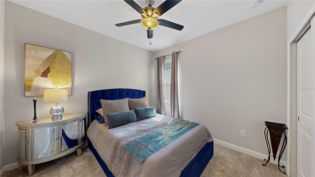 carpeted bedroom with a closet and ceiling fan