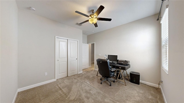 carpeted office with ceiling fan