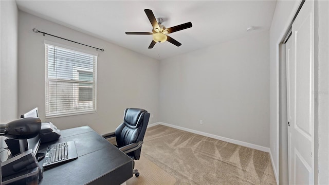 home office with ceiling fan and light colored carpet