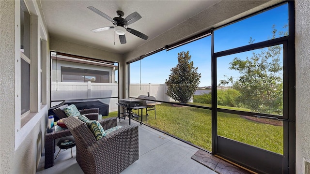 sunroom / solarium with ceiling fan