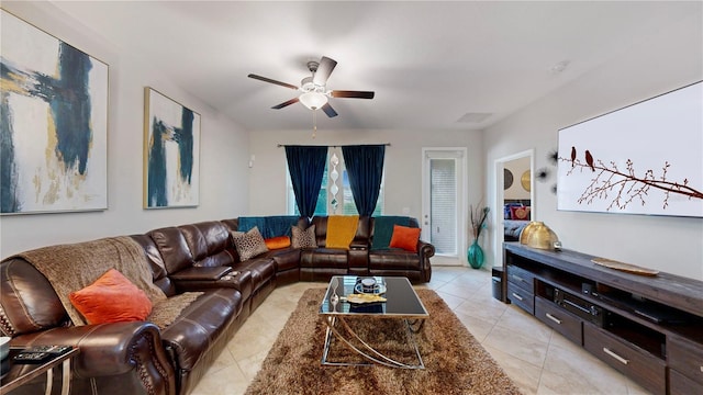 living room with ceiling fan and light tile patterned floors