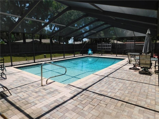 view of pool with a lanai and a patio area