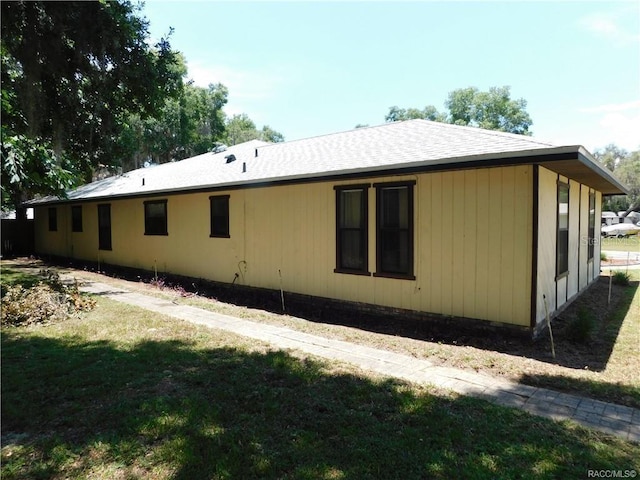 rear view of house with a yard