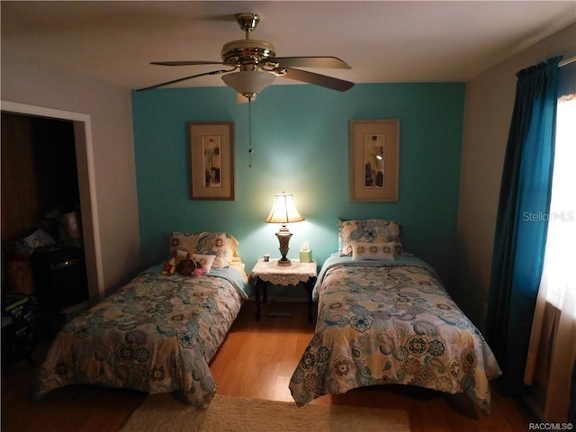 bedroom featuring ceiling fan and light hardwood / wood-style floors