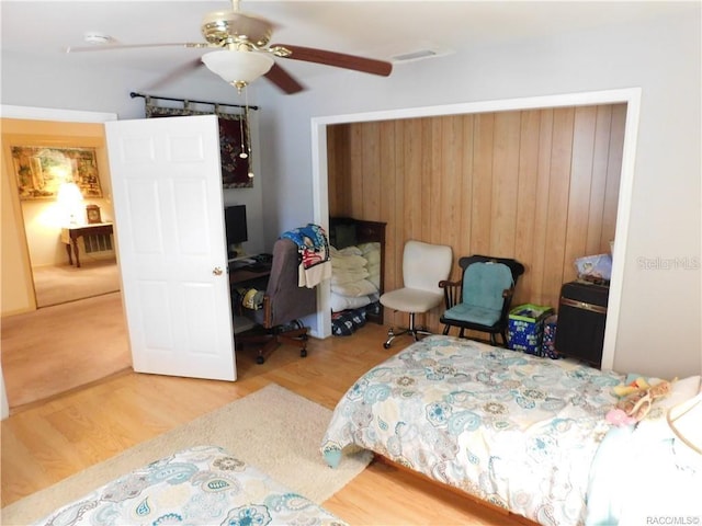 bedroom with hardwood / wood-style flooring and ceiling fan