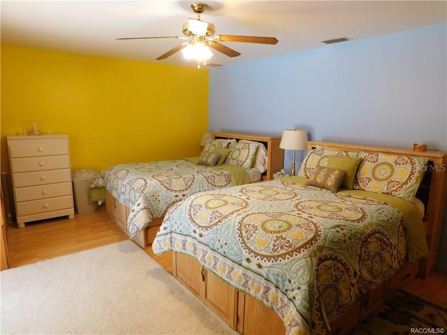 bedroom featuring ceiling fan and light hardwood / wood-style flooring