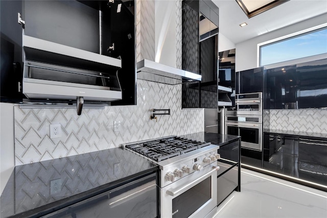 kitchen featuring backsplash, appliances with stainless steel finishes, and wall chimney exhaust hood