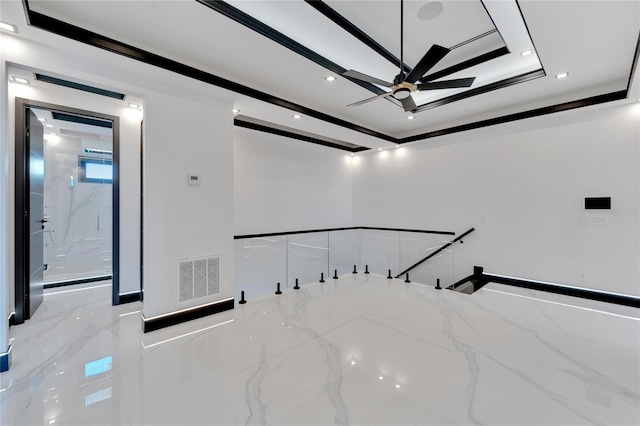 unfurnished room featuring ceiling fan, crown molding, and a tray ceiling