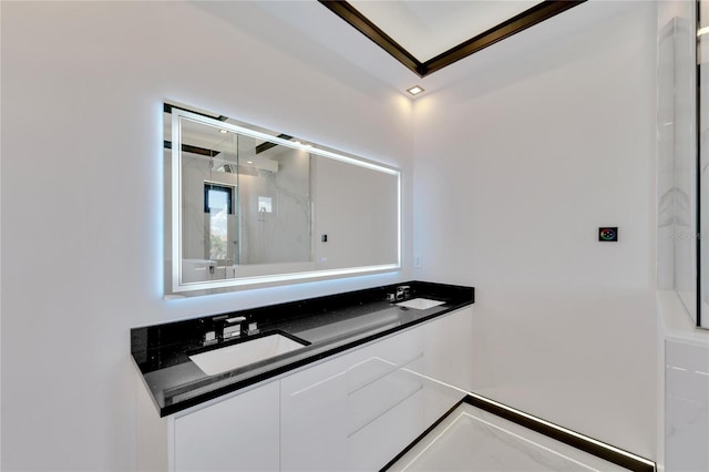 bathroom featuring a shower and vanity