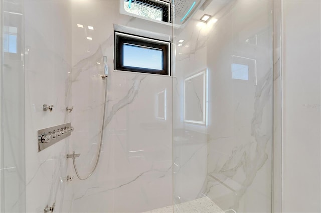 bathroom with a tile shower