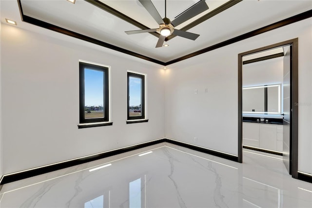 spare room featuring ceiling fan and crown molding