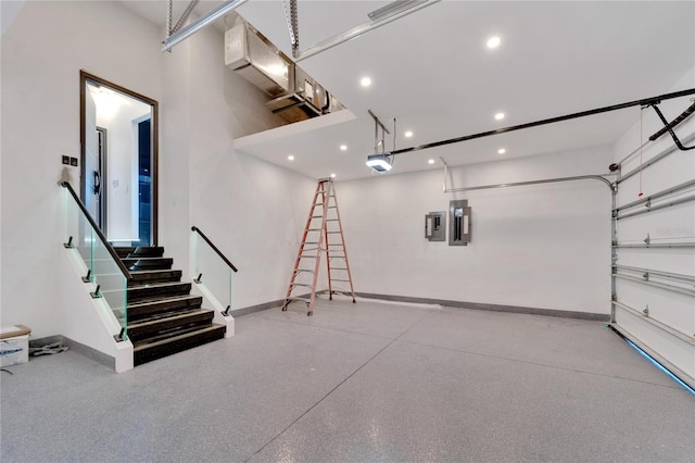 garage with a garage door opener and electric panel