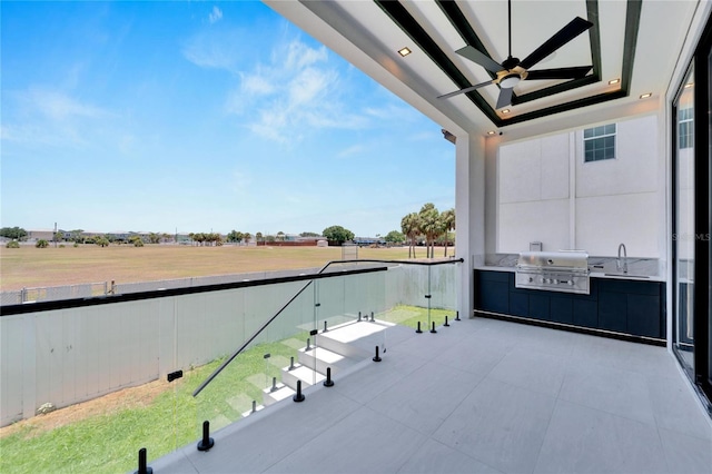 balcony with a grill, area for grilling, and sink