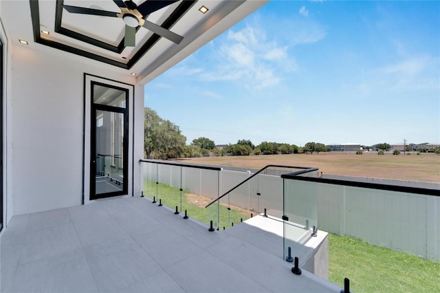 balcony featuring a patio area and ceiling fan