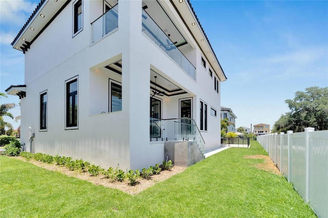 view of property exterior featuring a lawn