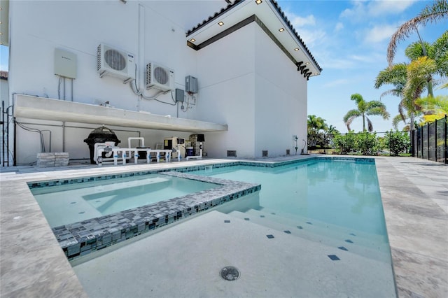 view of pool with ac unit and a patio area