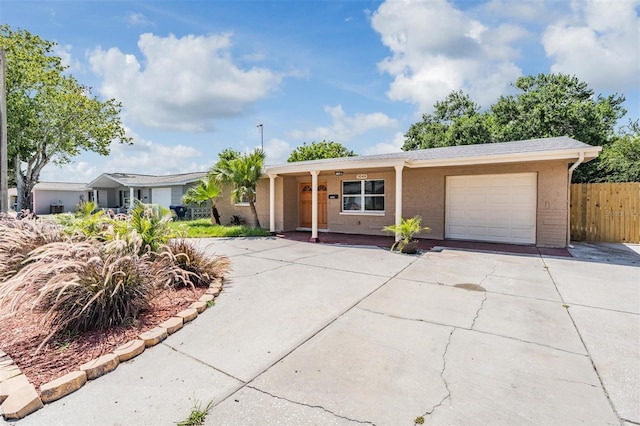 ranch-style home featuring a garage