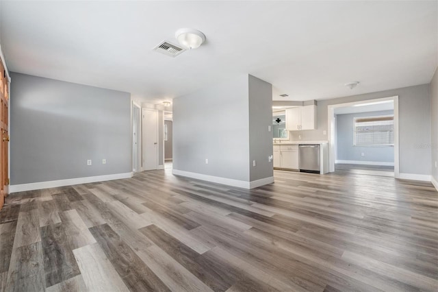 unfurnished living room with wood-type flooring