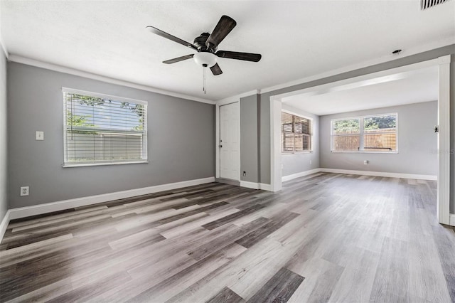 unfurnished living room with hardwood / wood-style flooring and ceiling fan