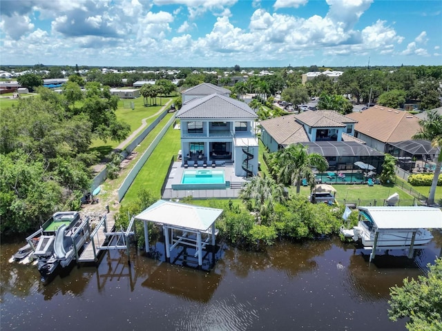 birds eye view of property with a water view