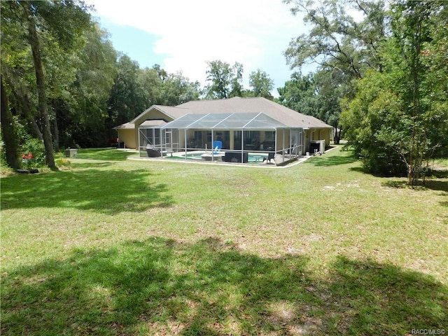 1874 W Pearson St, Hernando, FL 34442 - back of property featuring a lanai and a lawn