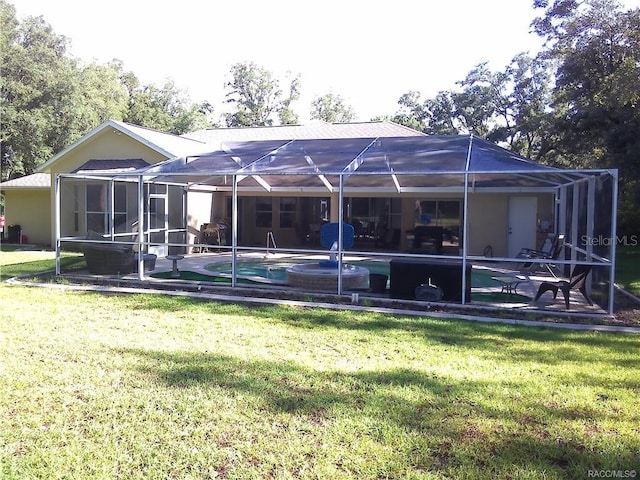 1874 W Pearson St, Hernando, FL 34442 - back of property with a lanai, a lawn, and a patio area