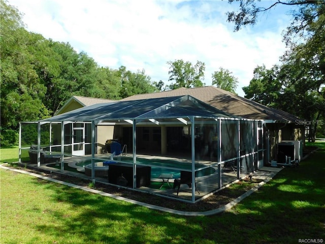 1874 W Pearson St, Hernando, FL 34442 - rear view of house featuring a lanai, a patio area, and a lawn