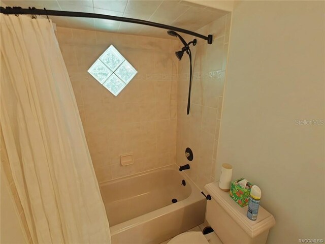 1874 W Pearson St, Hernando, FL 34442 - bathroom with shower / tub combo with curtain and toilet