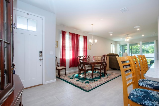 dining space with a notable chandelier and a wealth of natural light