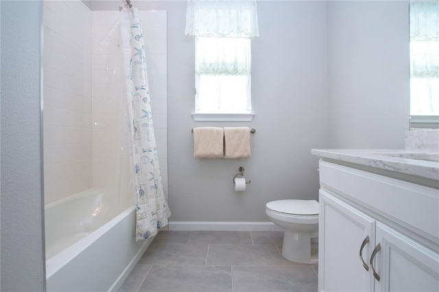 full bathroom with toilet, tile patterned floors, vanity, and shower / bath combo with shower curtain