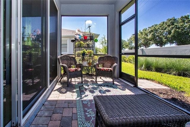 sunroom / solarium featuring a healthy amount of sunlight