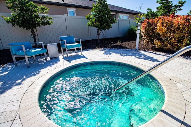 view of swimming pool featuring a patio